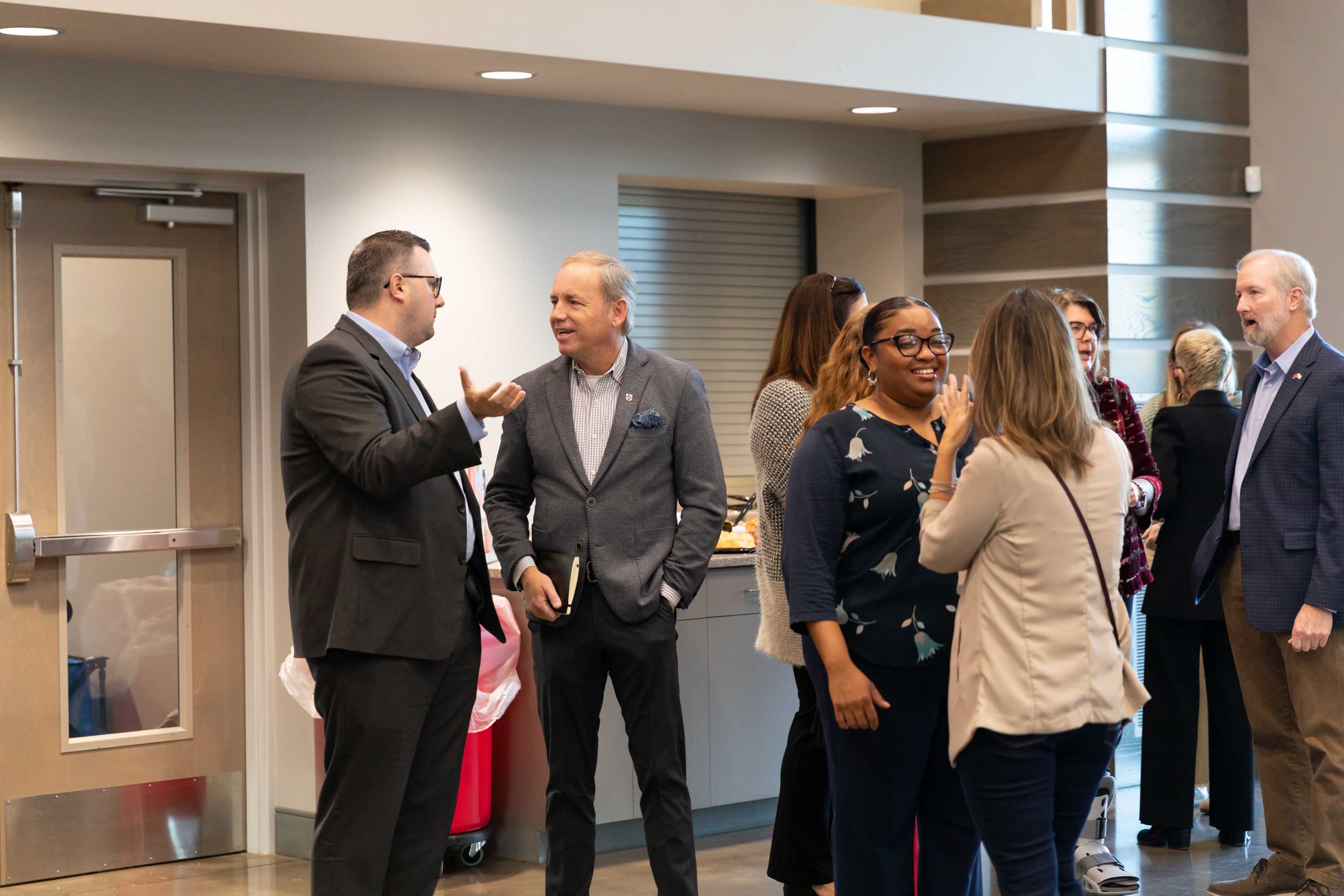 Attendees are mingling at the Executive Breakfast