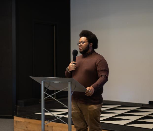 student leading a meeting