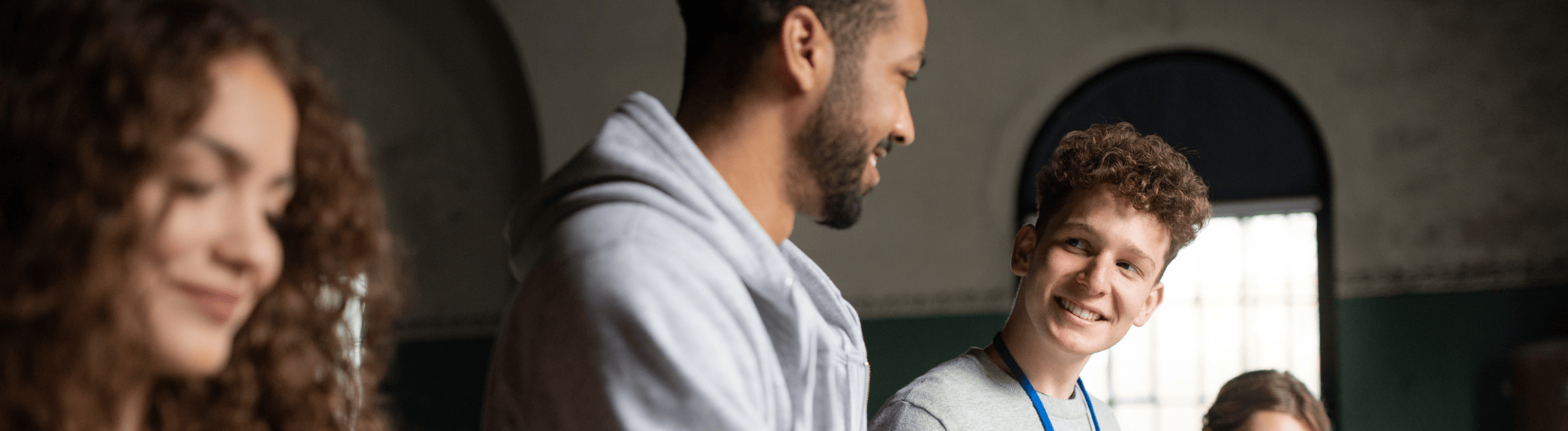 A group of young adults are doing service work.